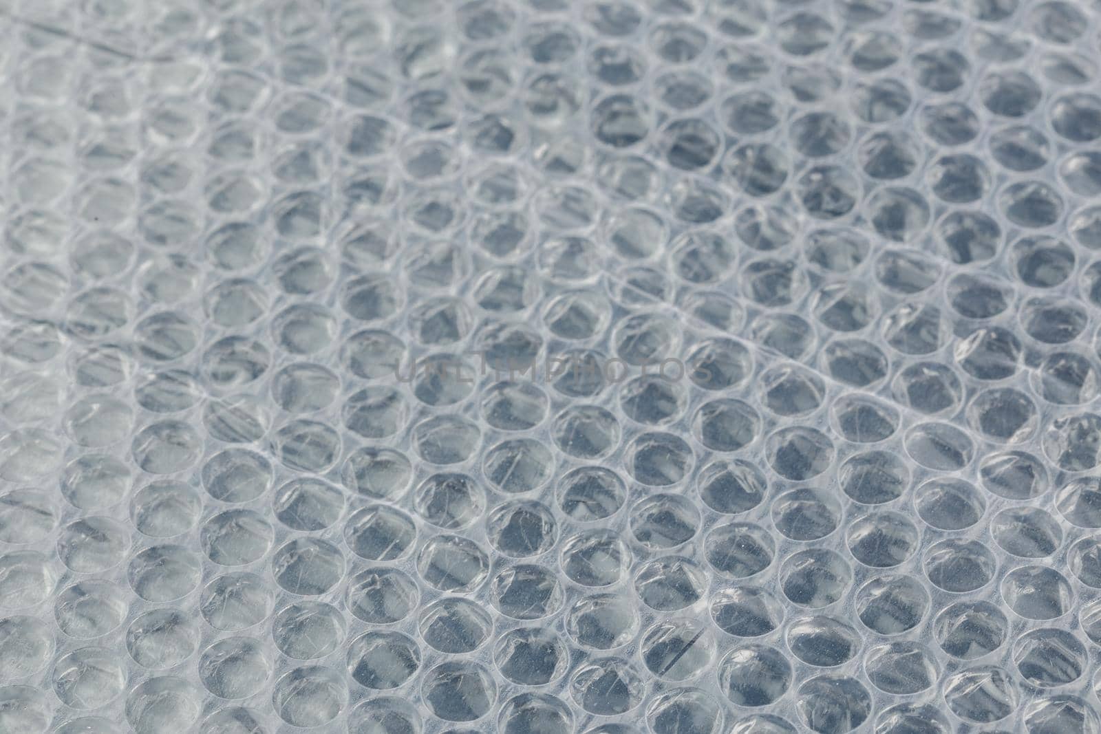 air bubble wrap - real life close-up background with selective focus and blur.