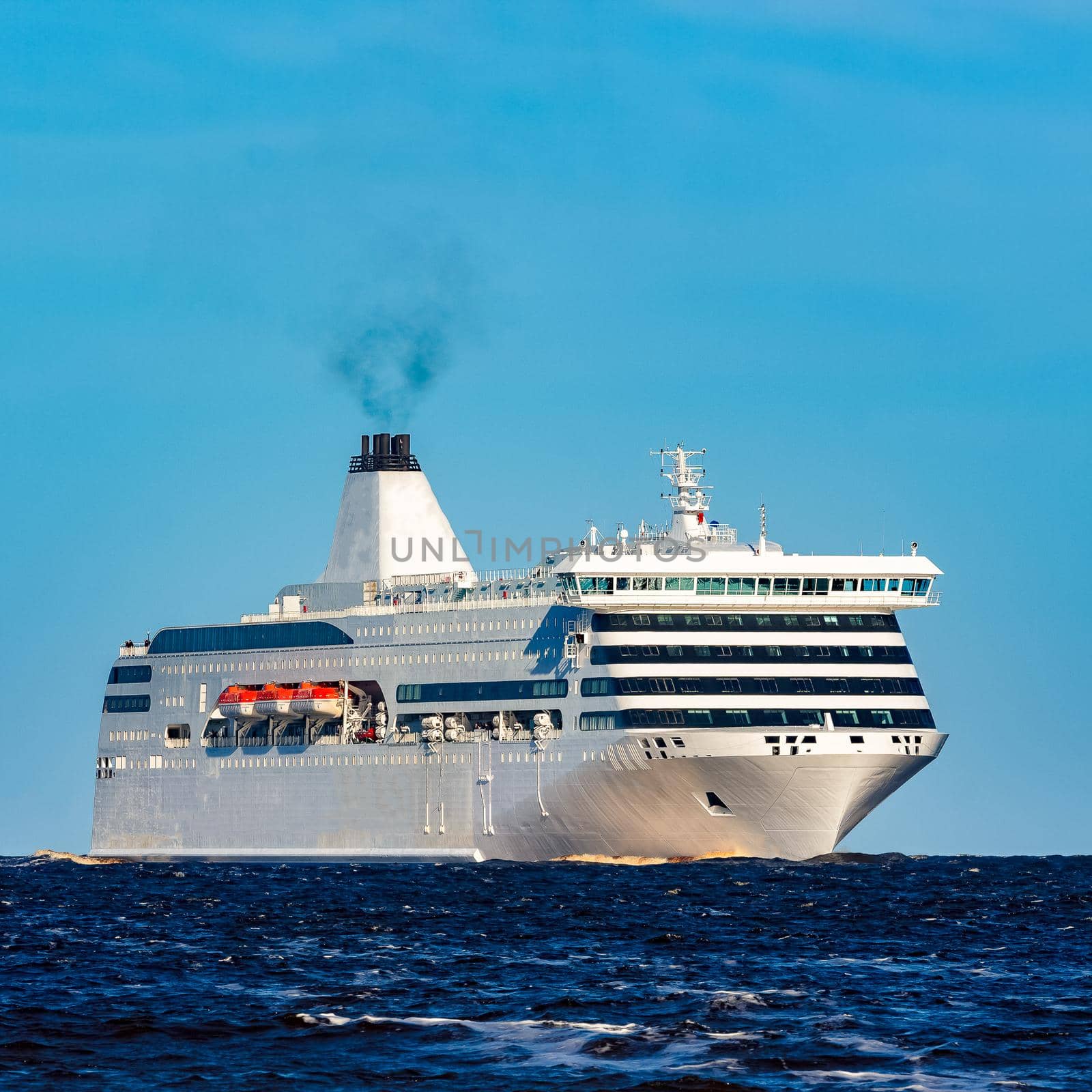 White cruise liner sailing on a clear day