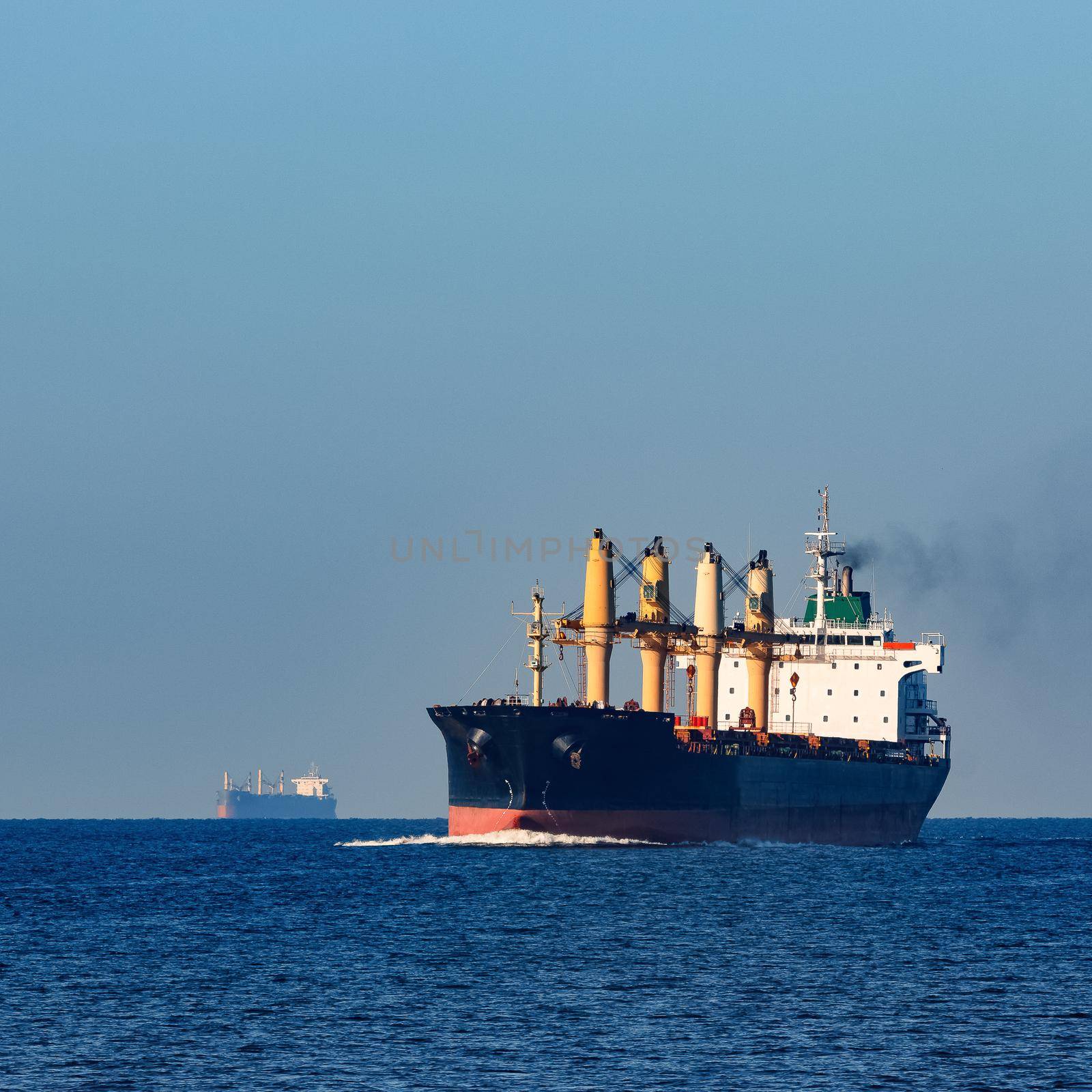 Black cargo ship sailing from the Baltic sea