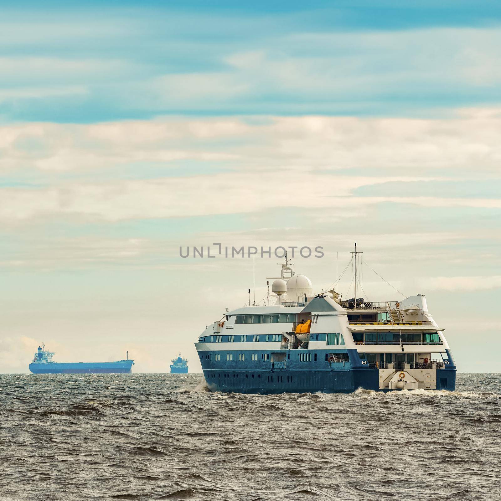 Small blue passenger ship sailing in Baltic sea. Spa services