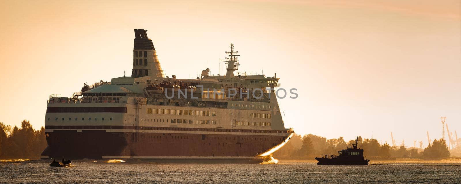 Big cruise liner. Passenger ferry ship entering Riga at morning