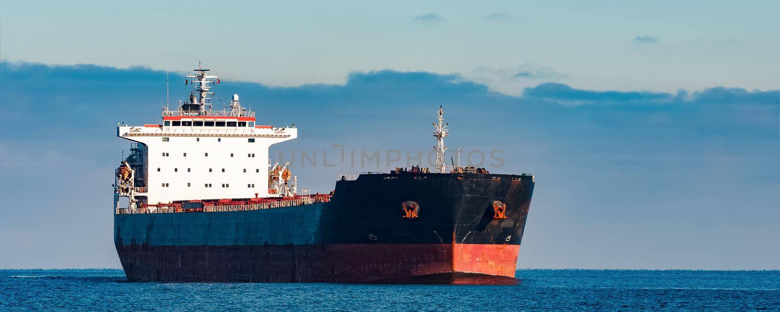 Black cargo ship by InfinitumProdux