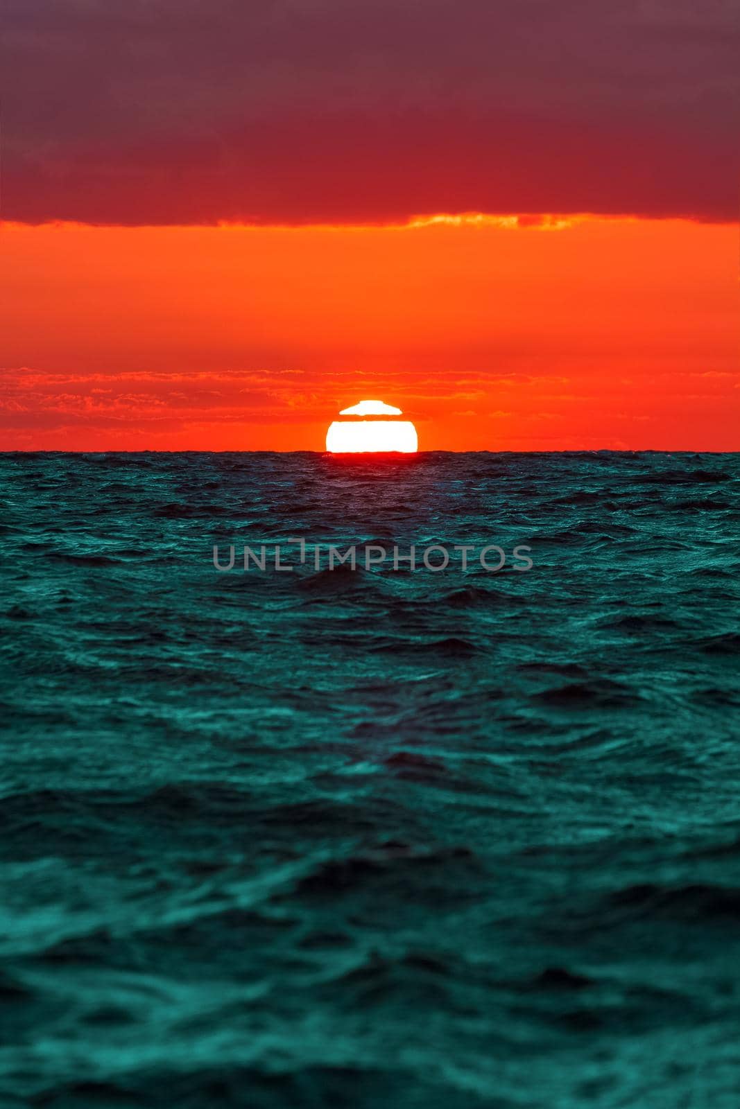 Hot and romantic sunset over the Baltic sea. Calm landscape