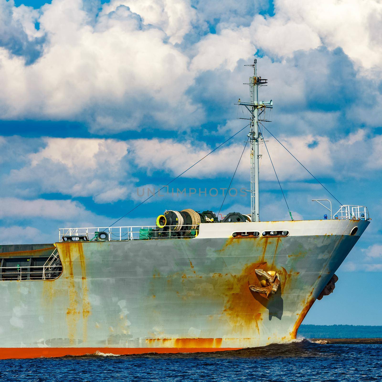 Grey cargo ship. Logistics and merchandise transportations