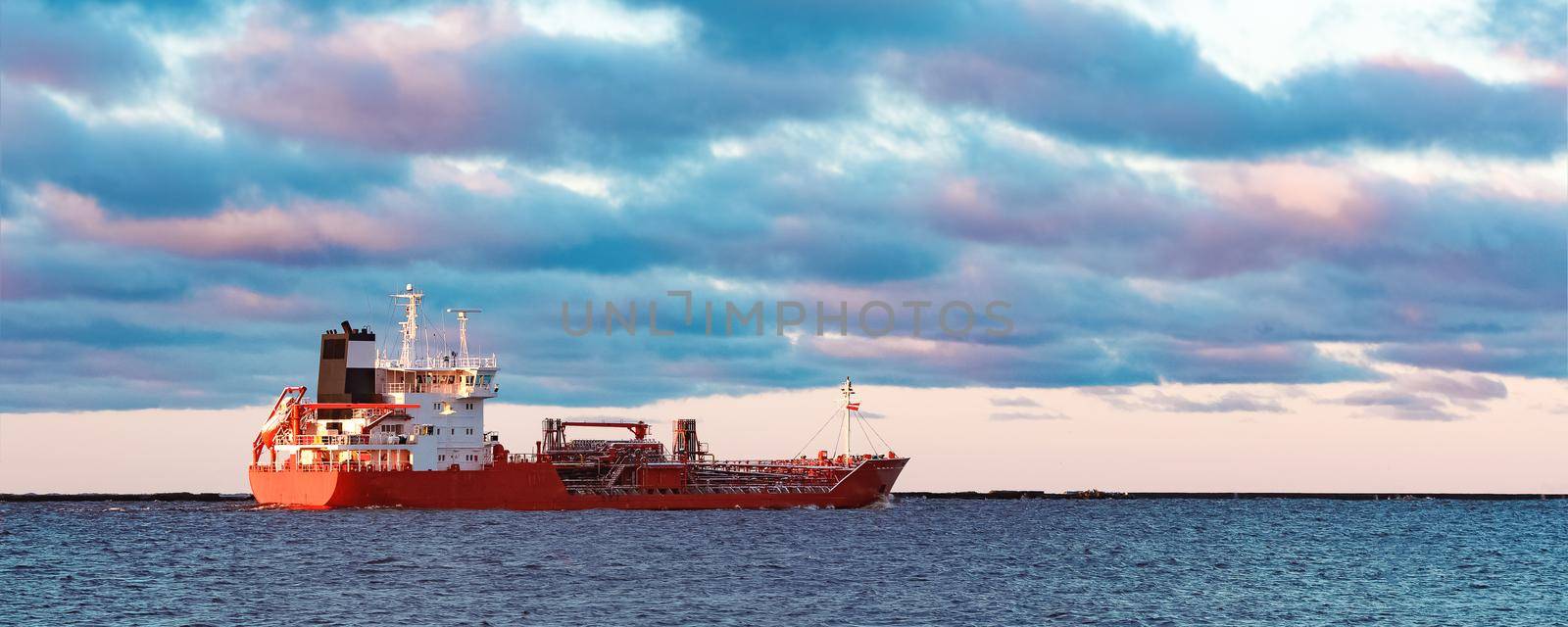 Red cargo oil tanker moving to Baltic sea