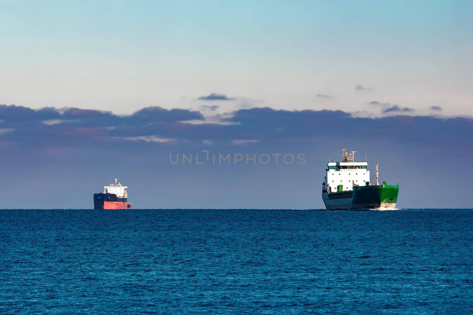 Cargo ships far in still water of Baltic sea