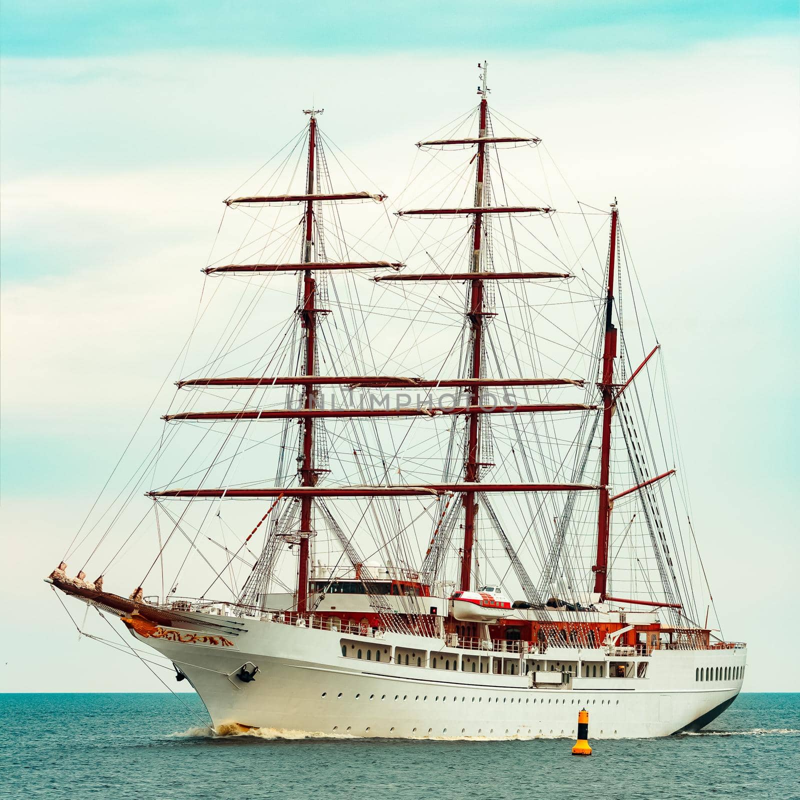 Big white sailing ship with three mast moving to the Riga port