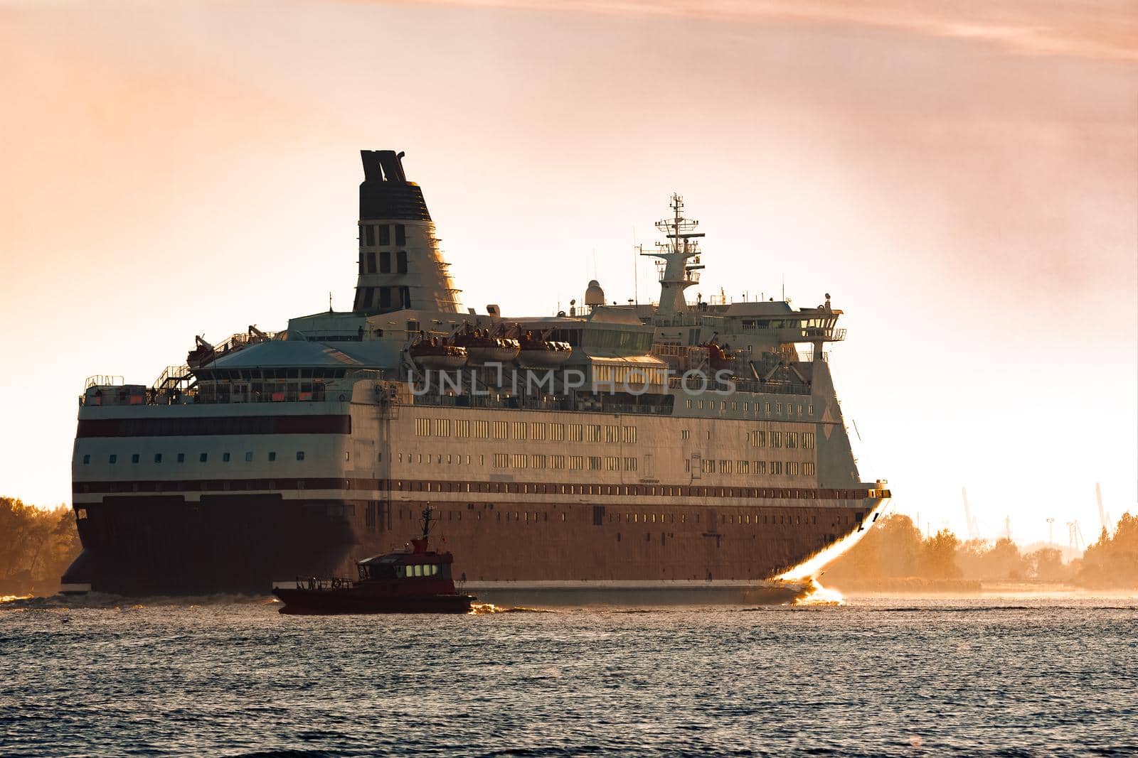 Big cruise liner. Passenger ferry ship entering Riga at morning