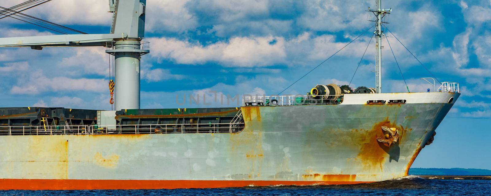 Grey cargo ship. Logistics and merchandise transportations
