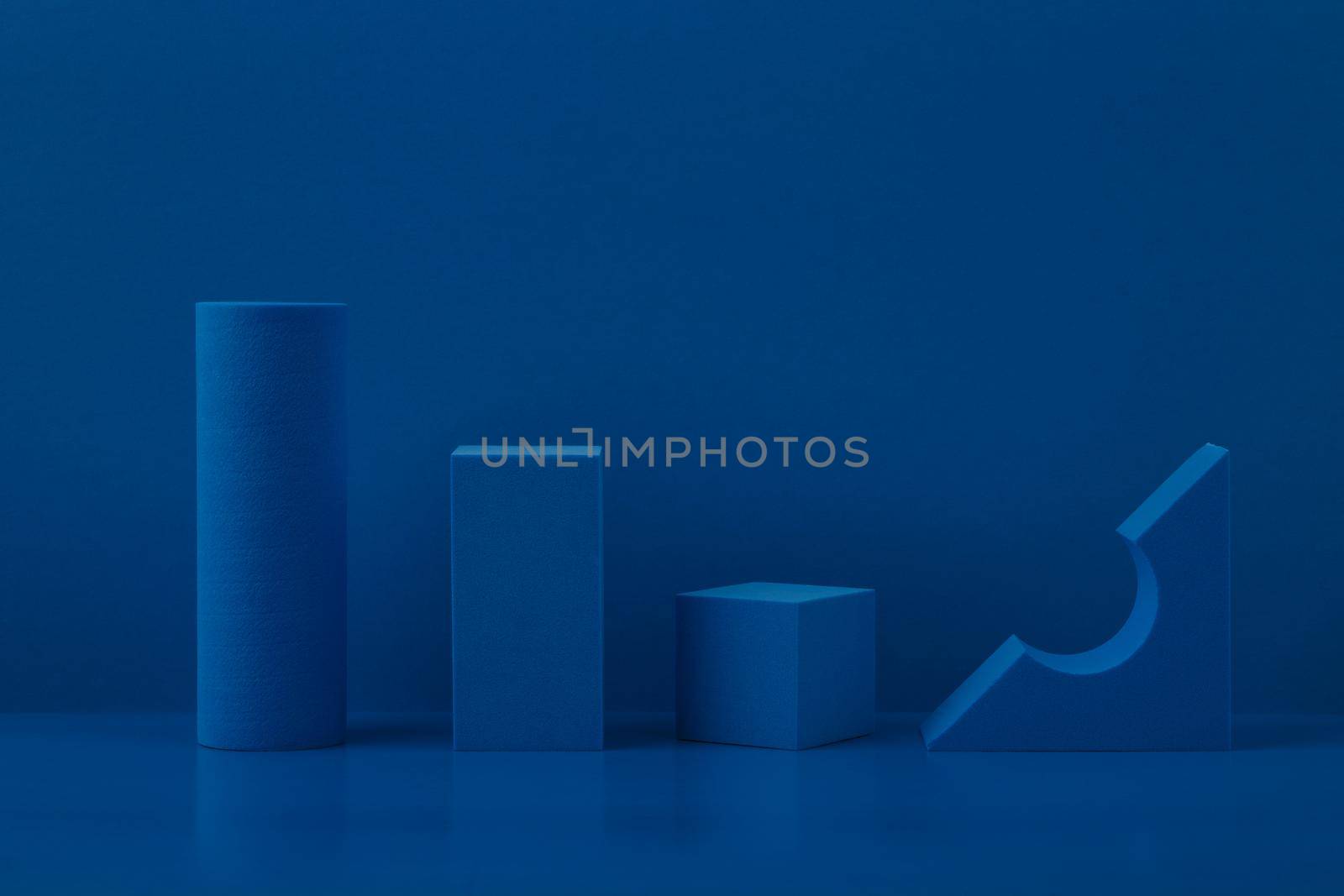 Abstract geometric composition with blue geometric figures against blue background. High quality photo