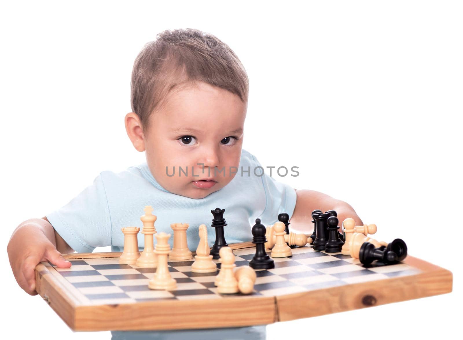 Happy boy with chessboard isolated on white by aprilphoto