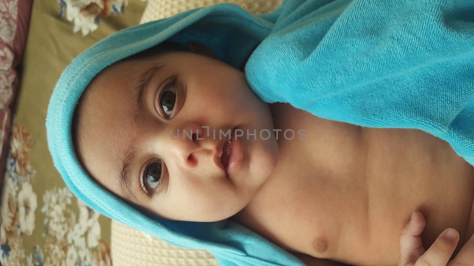 Baby girl with lovely face, big eyes and cute face gesture by Photochowk