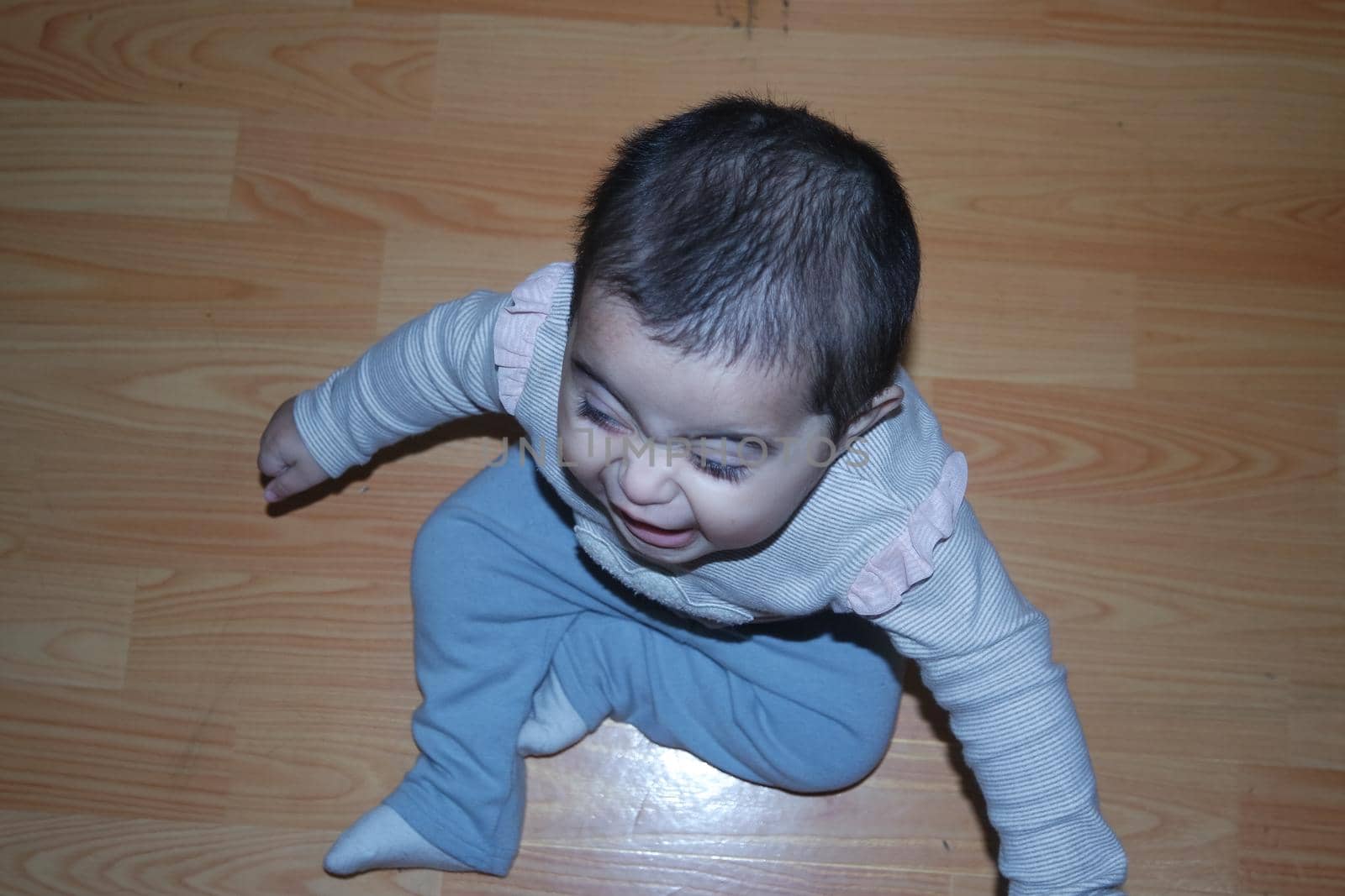 Baby girl with lovely face, big eyes and cute face gesture by Photochowk