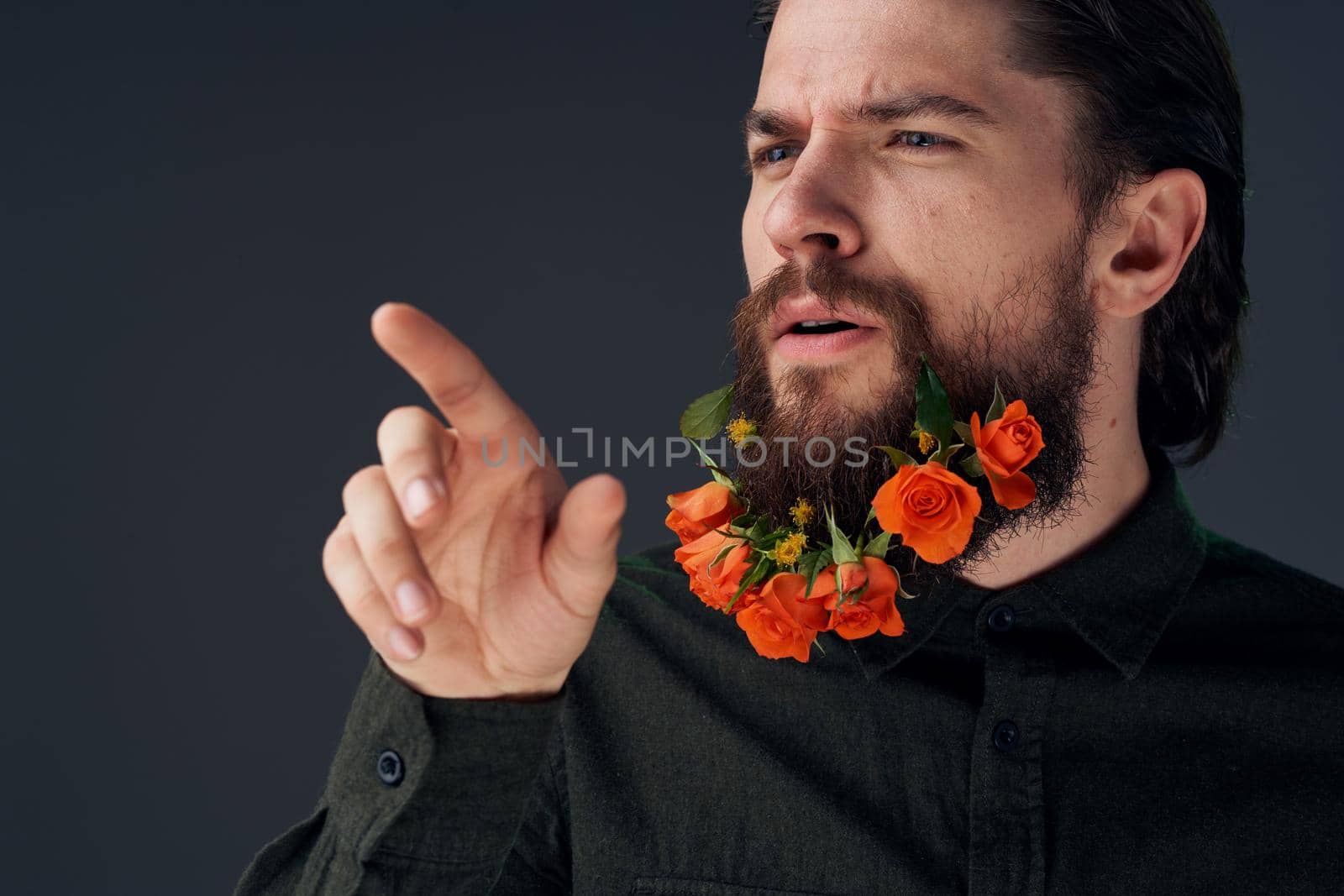 Nice man and flowers in the city decoration charm close-ups Studio. High quality photo