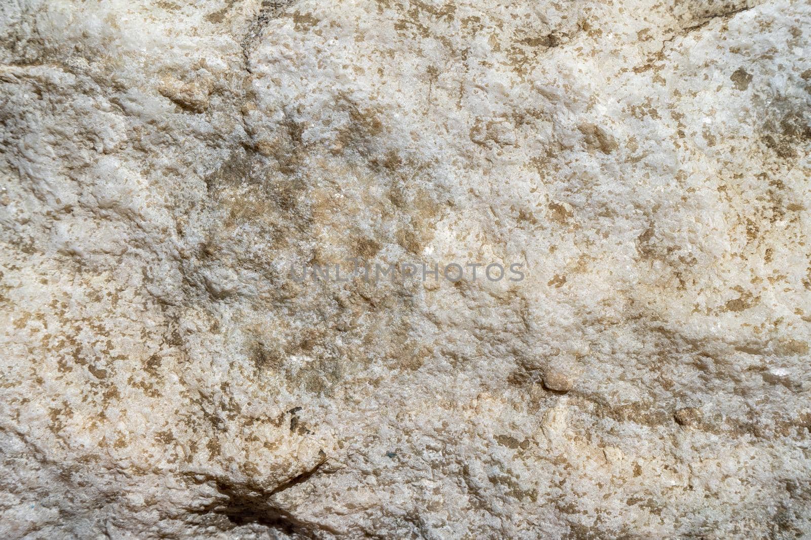 Natural background of light marble with a non-uniform texture.