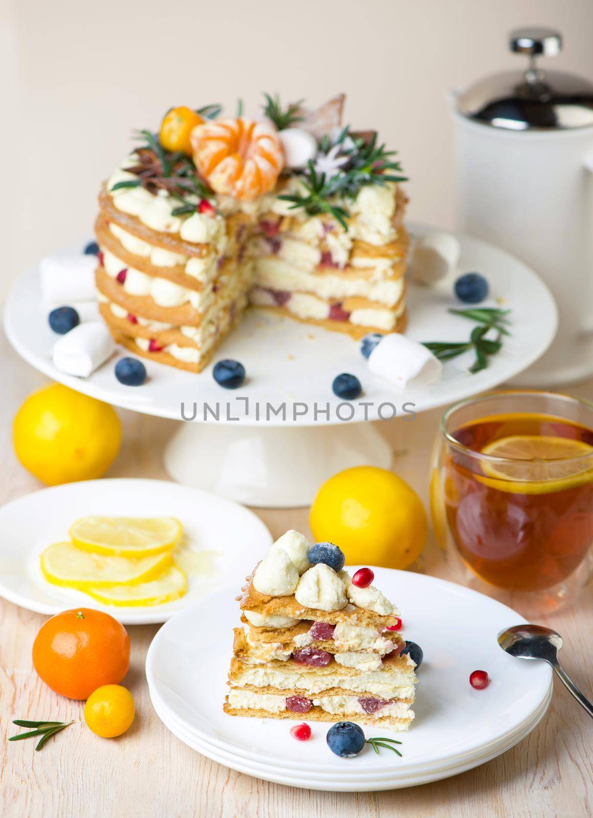 Honey cake pieces on a plate with lemon tea for dessert by aprilphoto