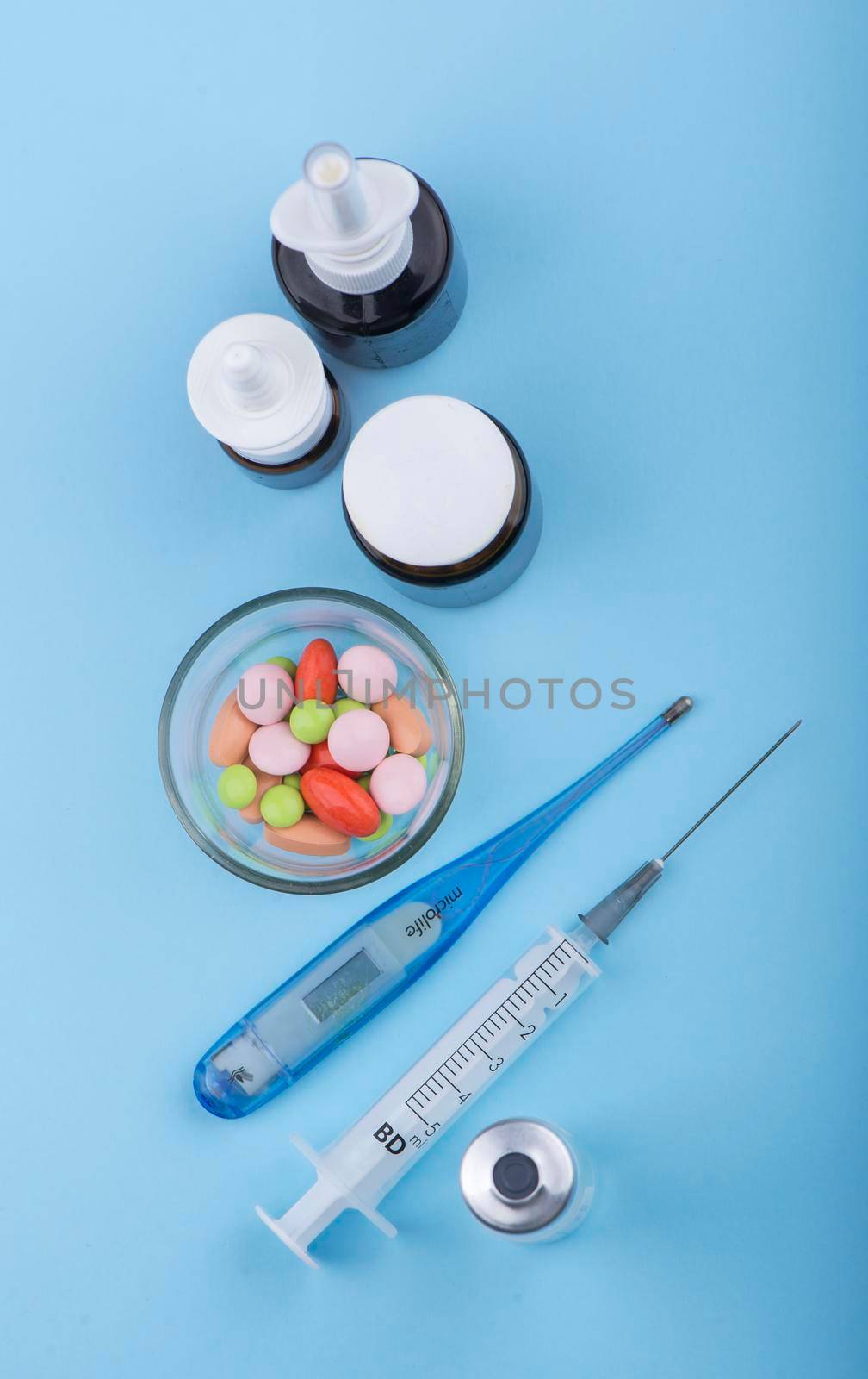 syringe and pills are on the table, medical supplies are on the table by aprilphoto