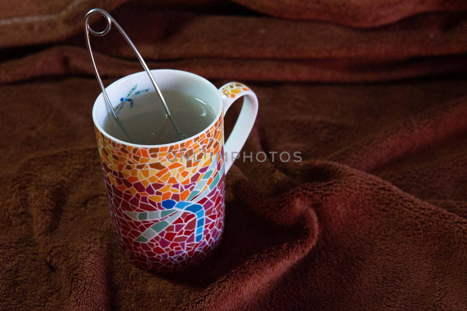 Making a tea in a colorful cup