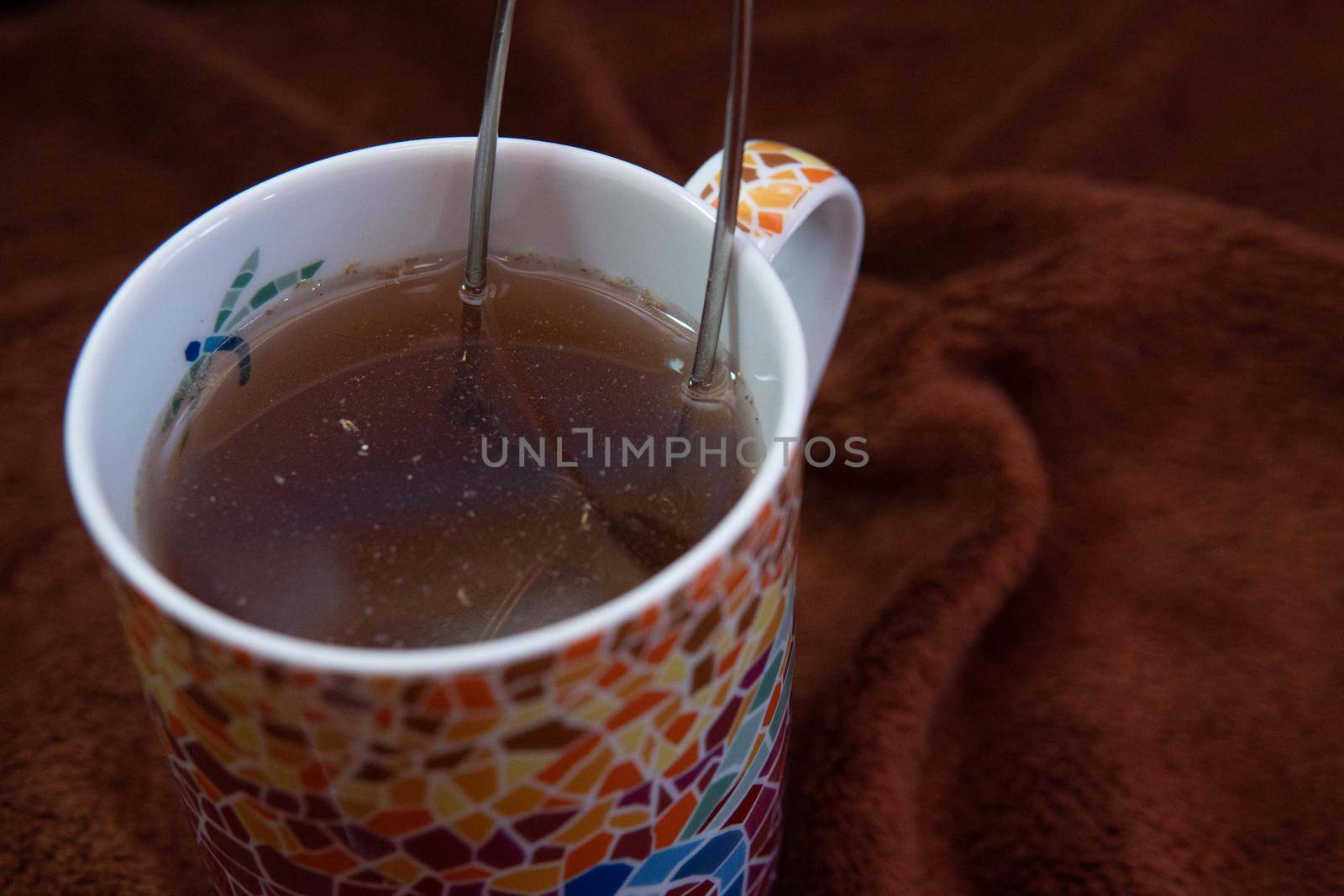 Making a tea in a colorful cup