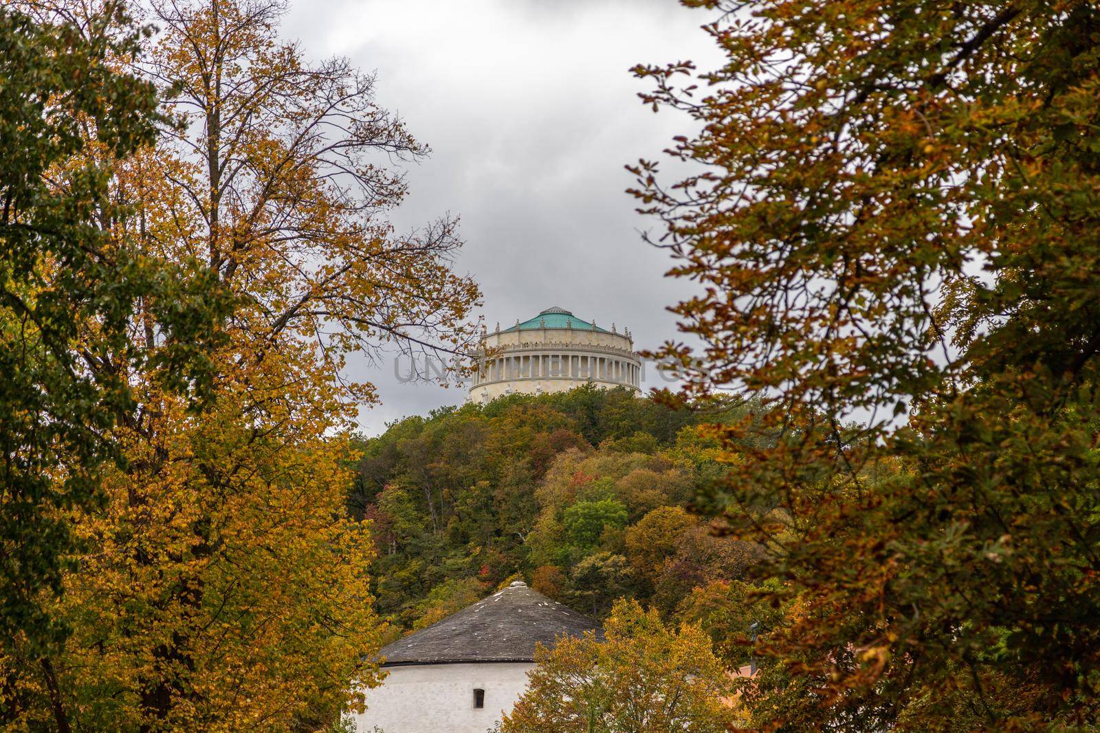 View at the liberation hall (Befreiungshalle) in Kelheim, Bavaria surrounded by autumnal colorful trees and bushes 