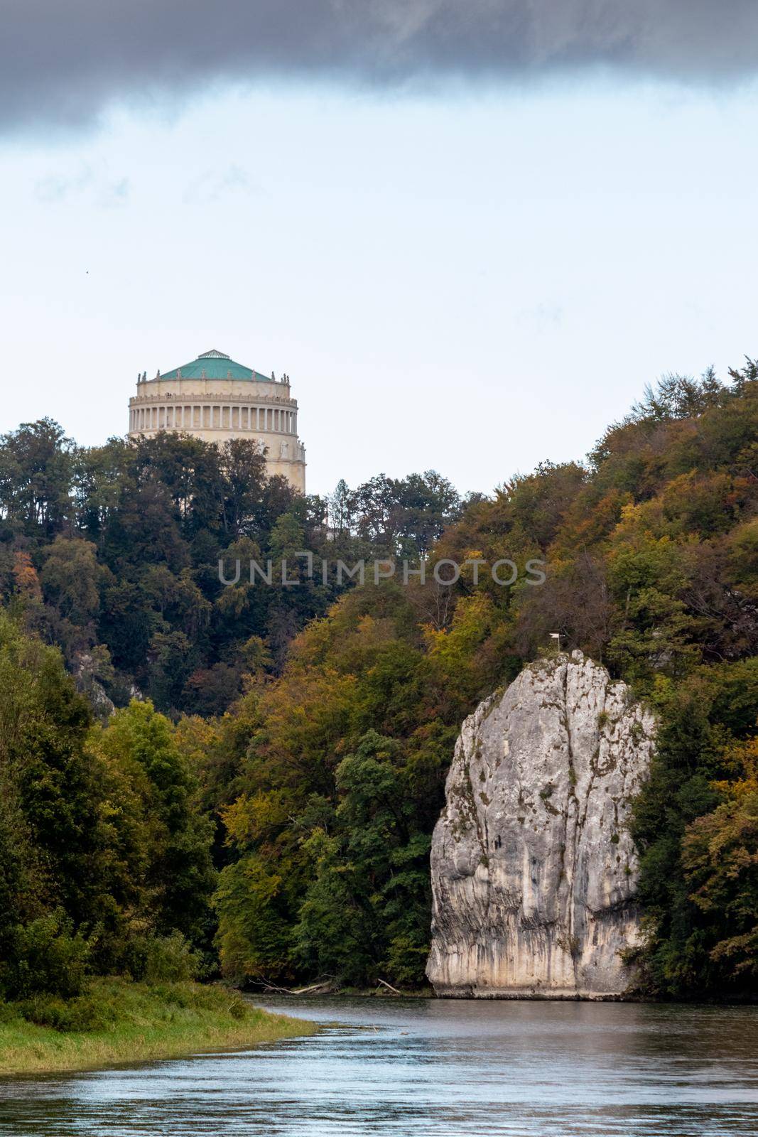 Nature reserve at Danube river breakthrough near Kelheim, Bavaria, Germany in autumn with limestone rock formations and Befreiungshalle on the Michelsberg in the background