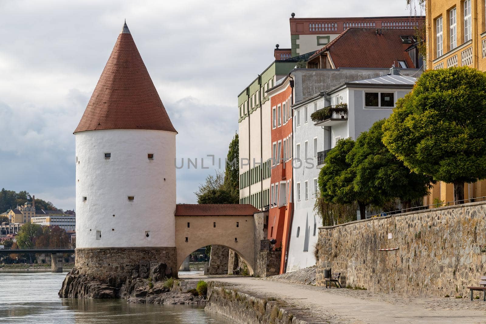 Historic tower (Schaiblingsturm) used for salt trading at shore of river Inn in Passau, Bavaria 