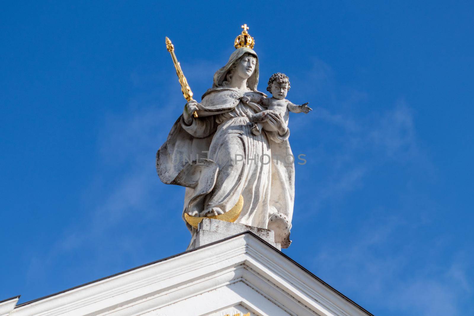 Statue with golden scepter and crown on St. Stephen's Cathedral (Dom St. Stephan) in Passau, Bavaria, Germany by reinerc