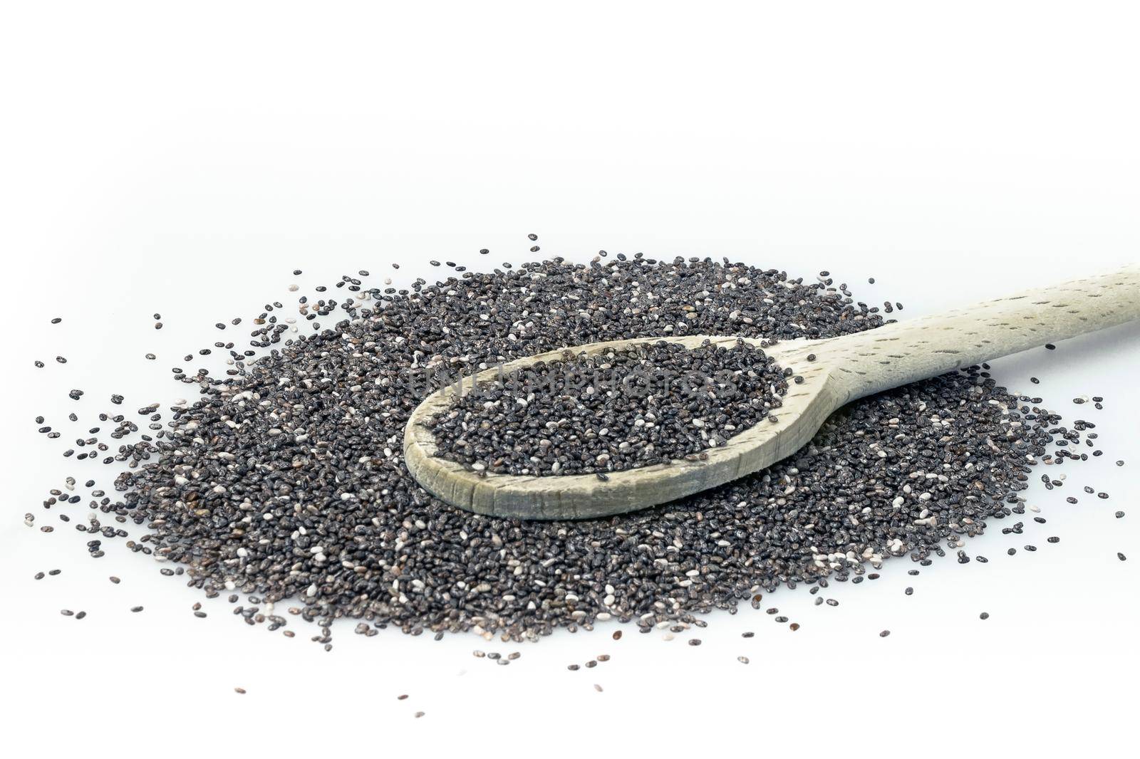 Chia on white background. Chia seeds in wooden spoon isolated with white background.