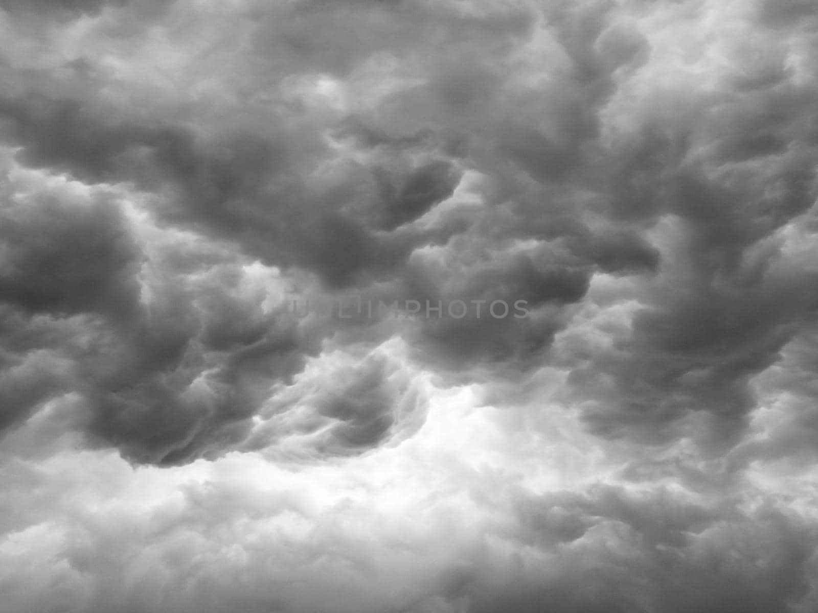 Black clouds formed before the rain. Ominous storm clouds. Sky before a thunderstorm. Used to make a background image.