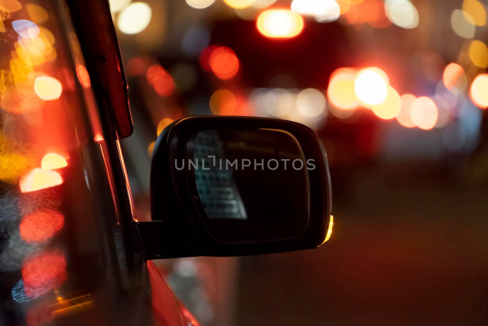 Car mirror on the background of the night by Vvicca