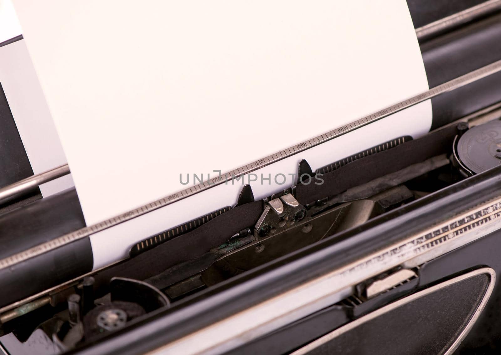 close up image of typewriter with paper sheet. copy space for your text. retro filtered by aprilphoto