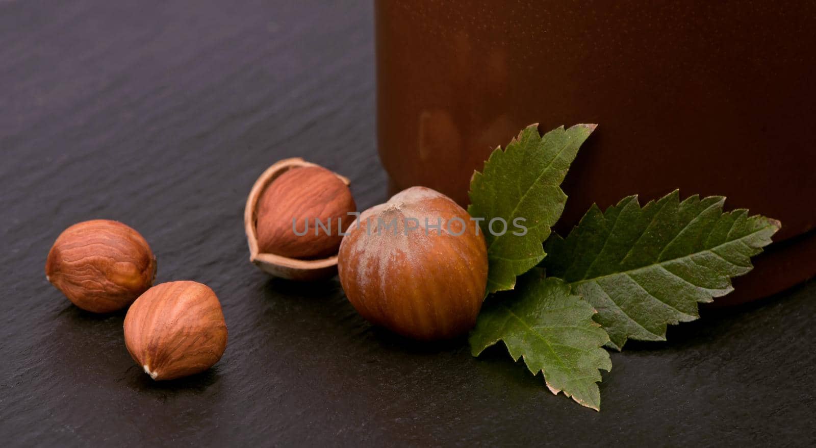 Closeup of hazelnuts on the wood table by aprilphoto