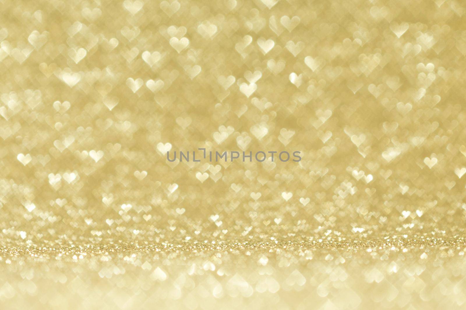 Valentines day abstract background with golden heart shape bokeh lights