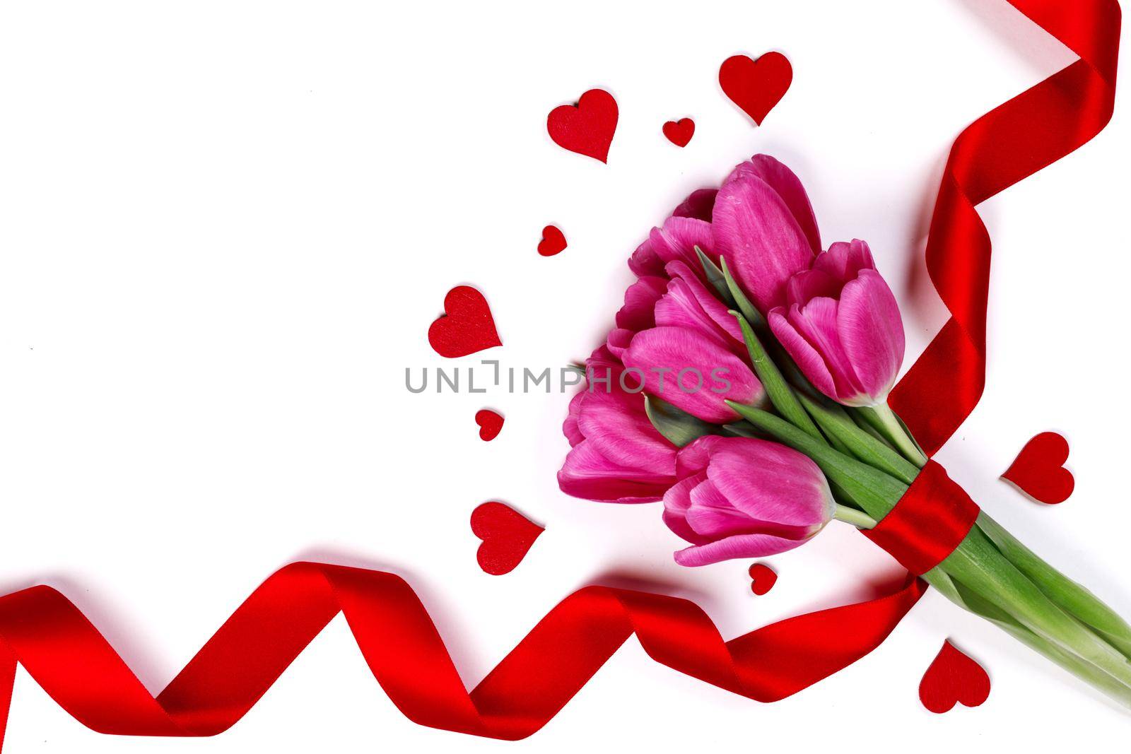 Valentines day hearts and pink tulip flowers isolated on white background