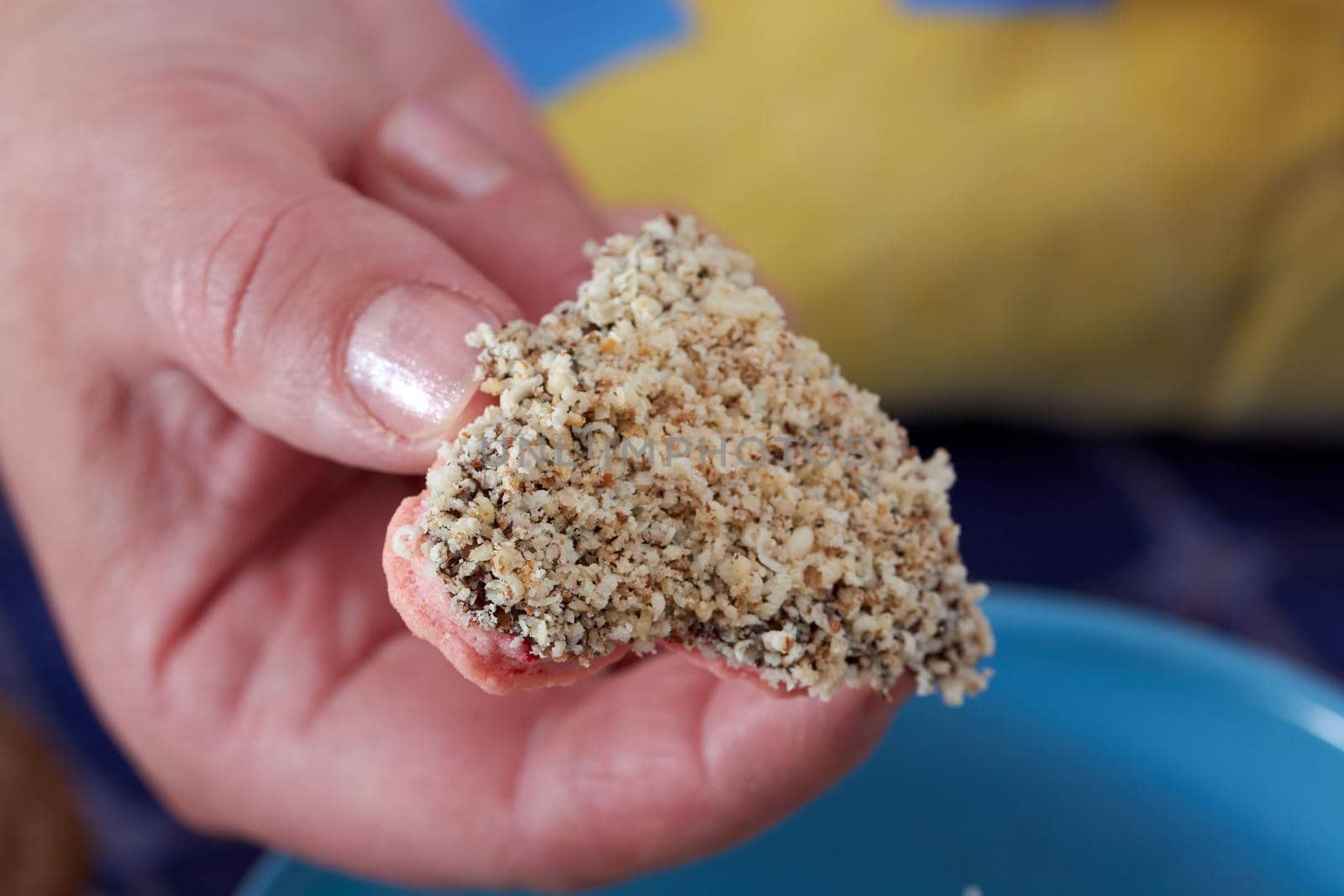 Pouring chocolate on just baked christmas cookies