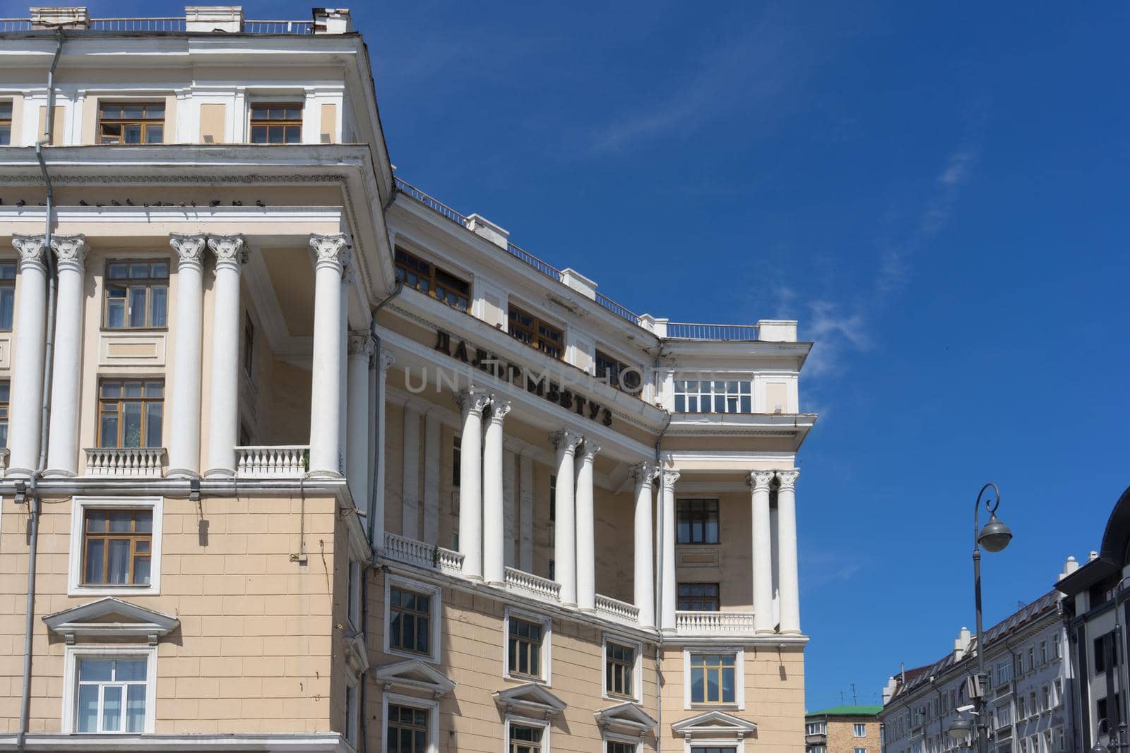 Urban landscape with streets and architecture of the city under the blue sky. by Vvicca