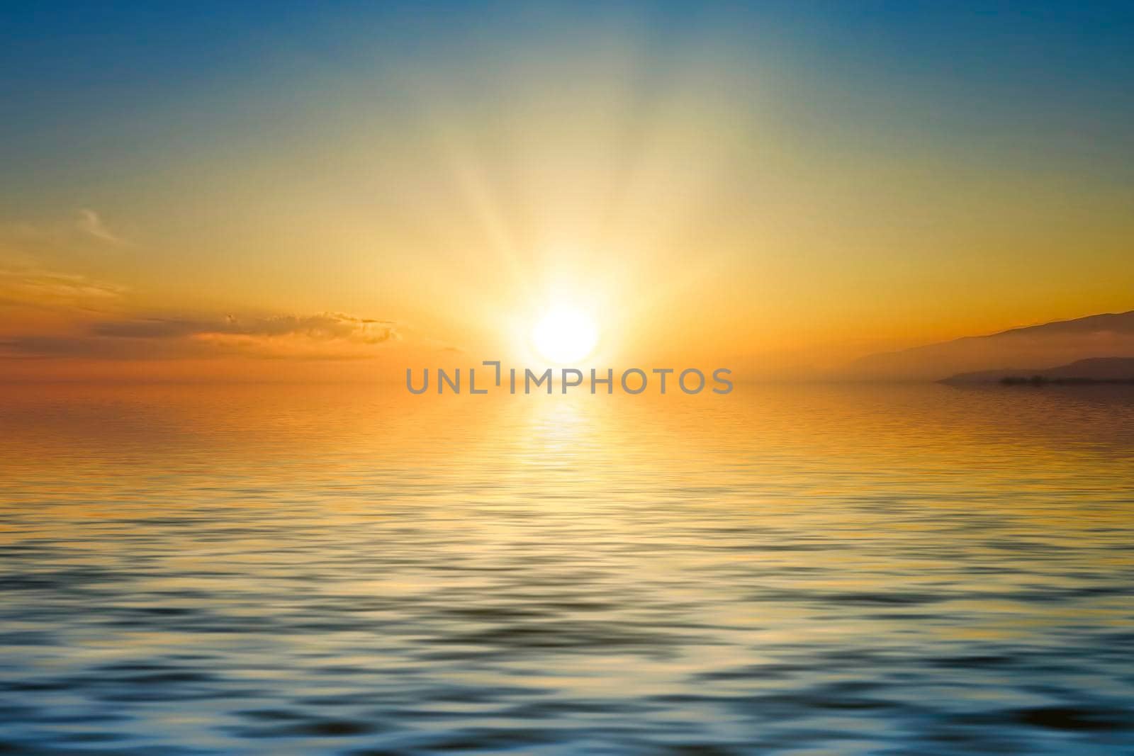 Magnificent bright sunset over the calm surface of the sea. For design and networking.