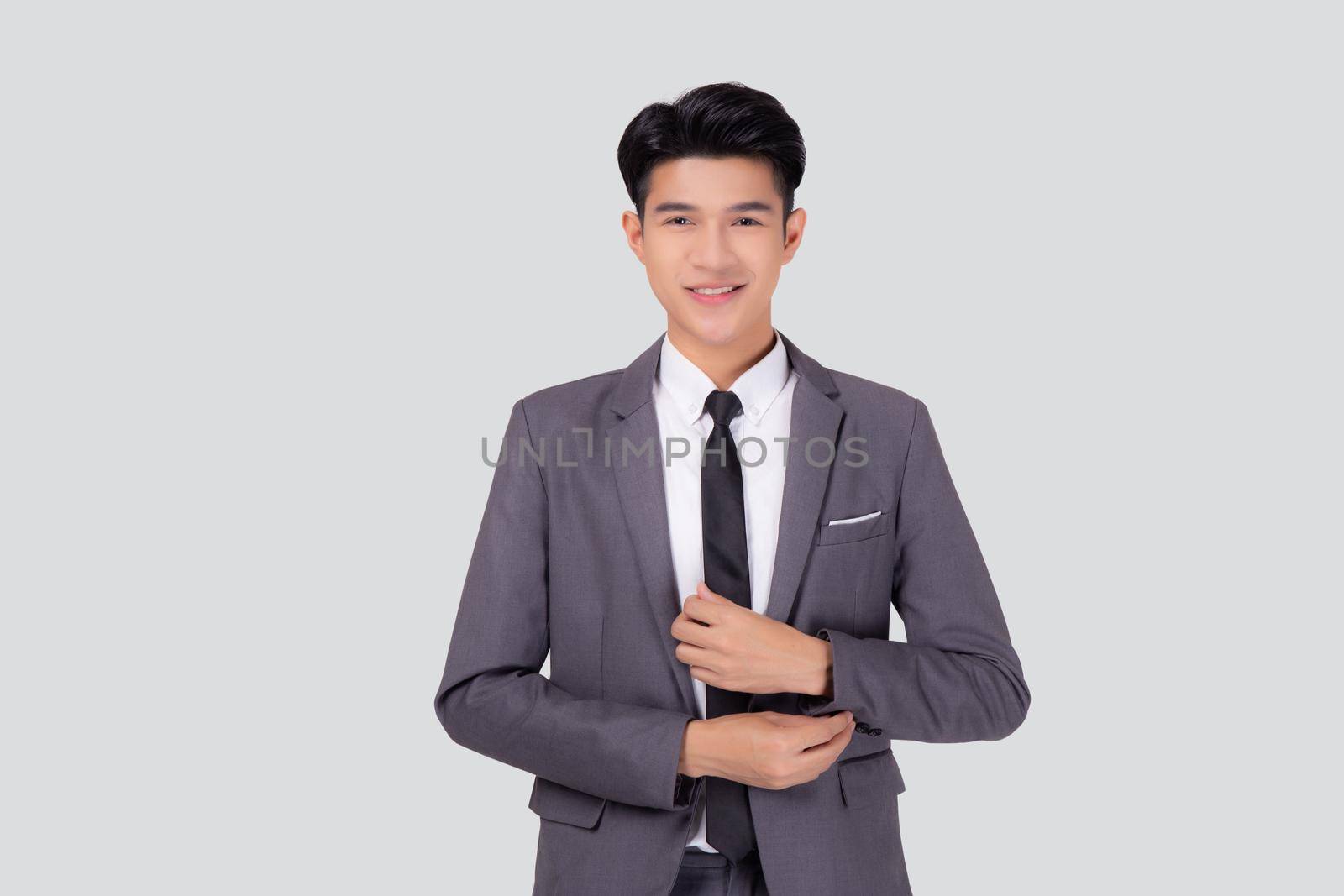 Portrait young asian businessman in suit smiling with confident and friendly isolated on white background, business man smart with success, manager or executive with handsome and leadership.