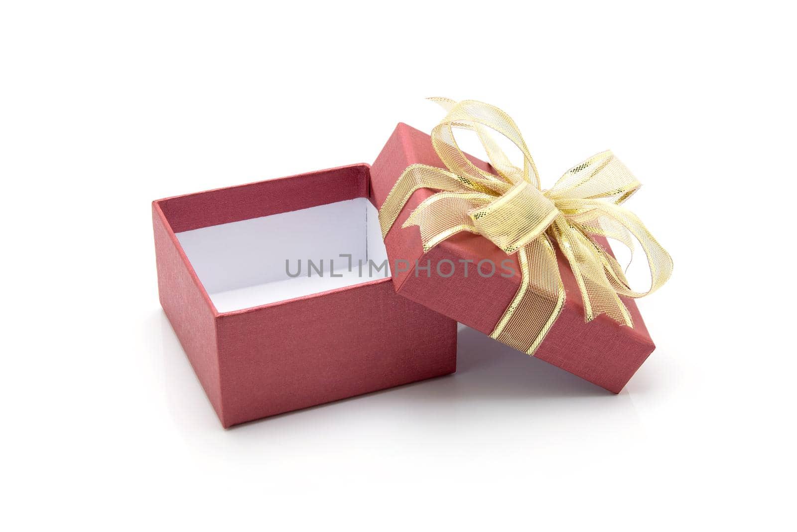 Red gift box and ribbon open isolated on white background, presents in valentine day or Christmas day, object in birthday or anniversary, package with wrap luxury, nobody, holiday and festive concept. by nnudoo
