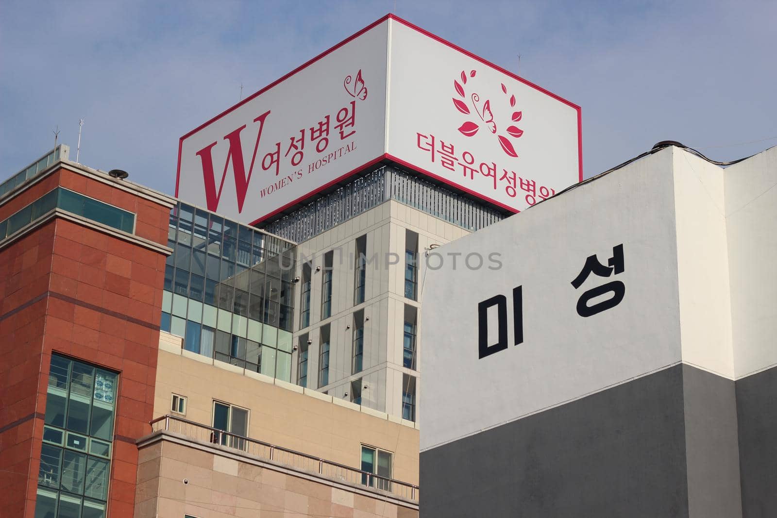 Low Angle View of Skyscraper Building in South Korea by Photochowk