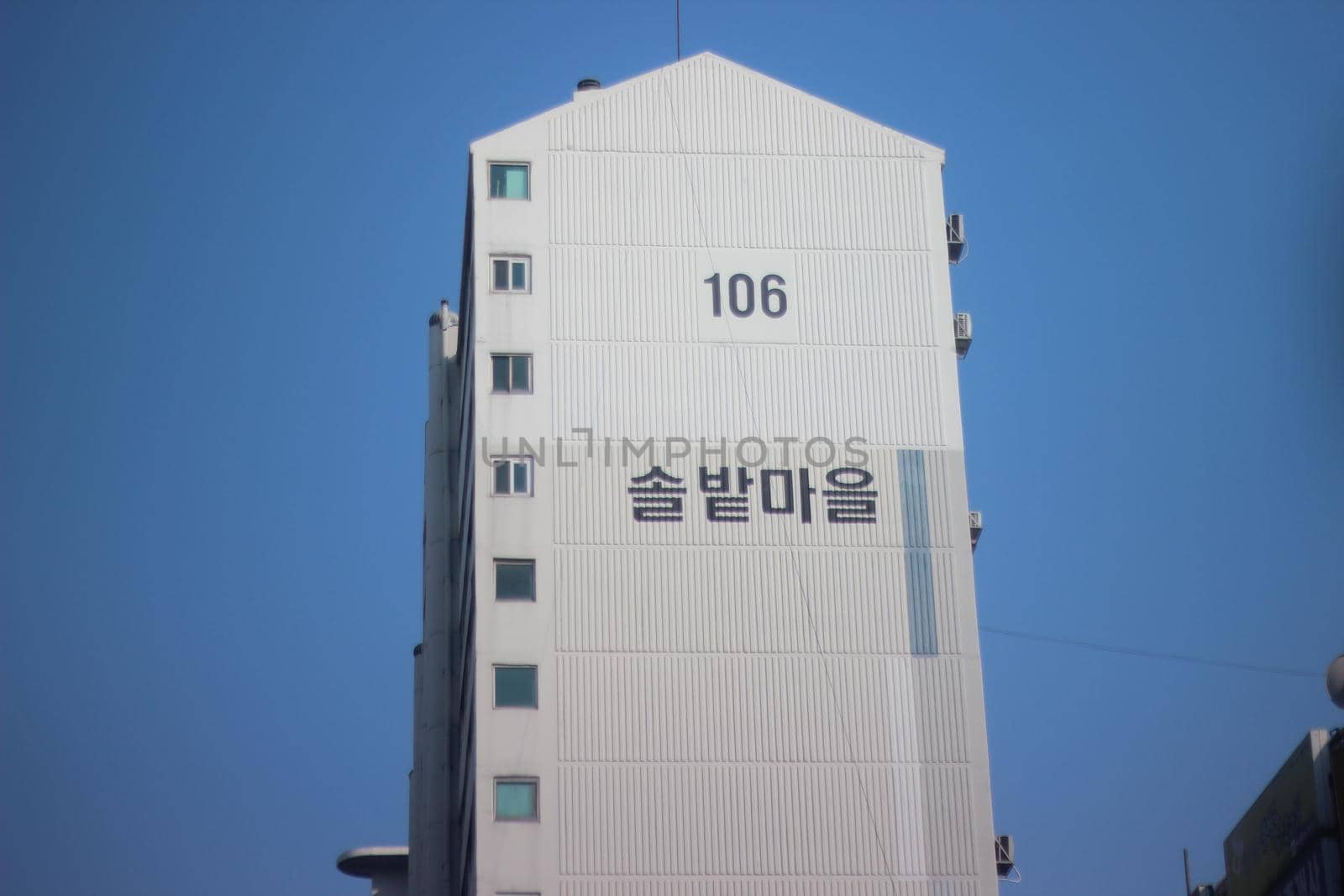 Low Angle View of Skyscraper Building by Photochowk