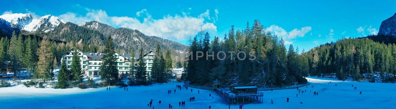 Braies Lake blotted in winter, aerial view from drone, Italian Alps by jovannig