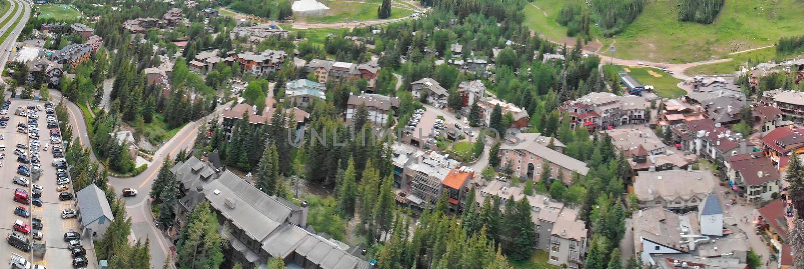 Vail city center and surrounding mountains, Colorado. Aerial view from drone in summer season by jovannig