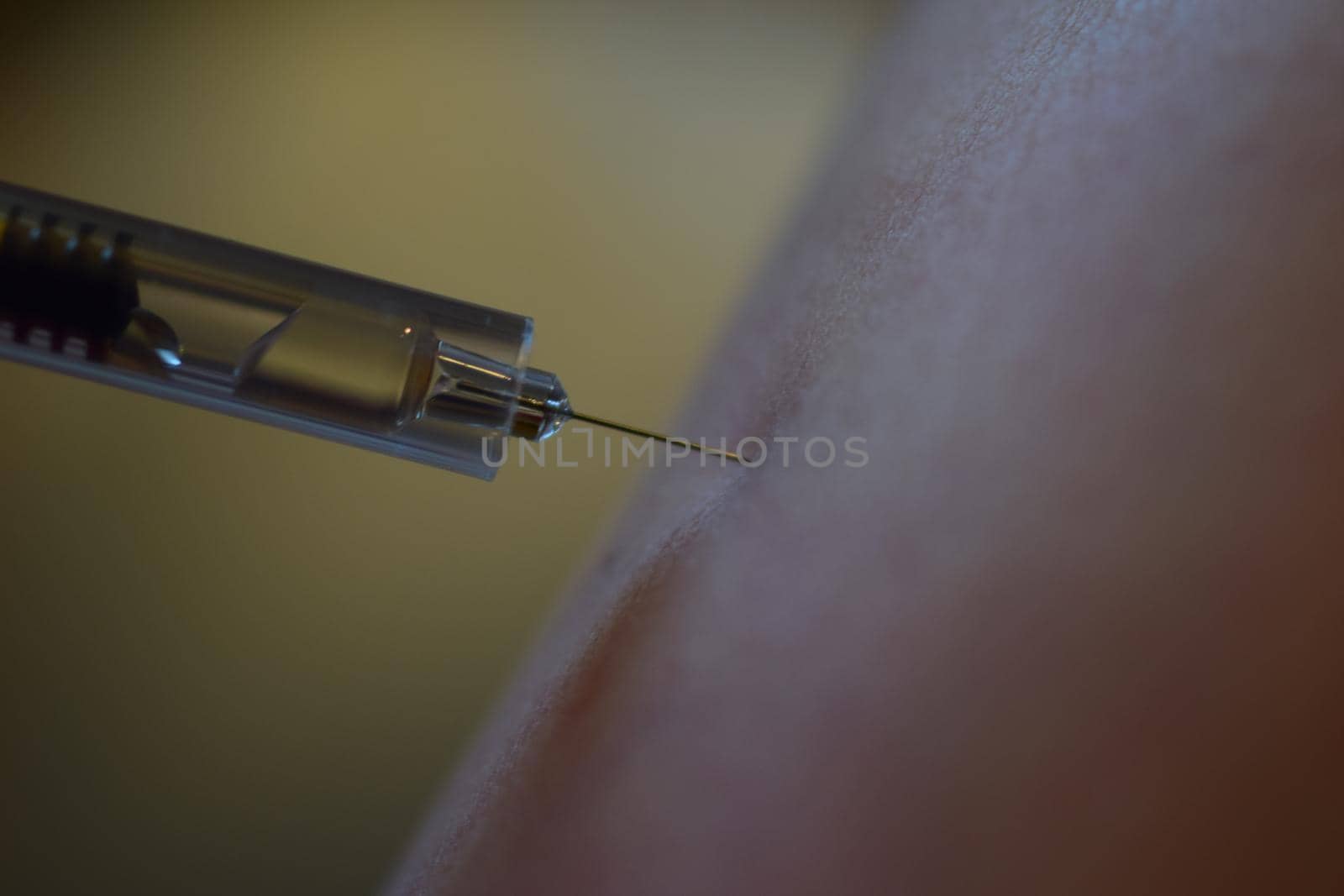 close-up of an injection before injecting it into the arm