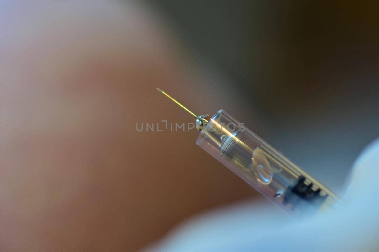 close-up of an injection before injecting it into the arm