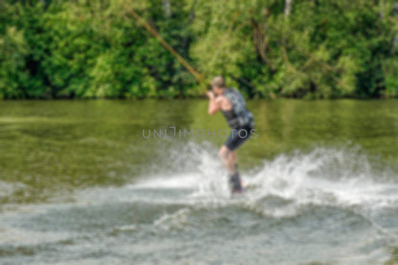 Creative story on the topic of kitesurfing with the blur and bokeh elements for thematic backdrops, posters and banners. by Grommik