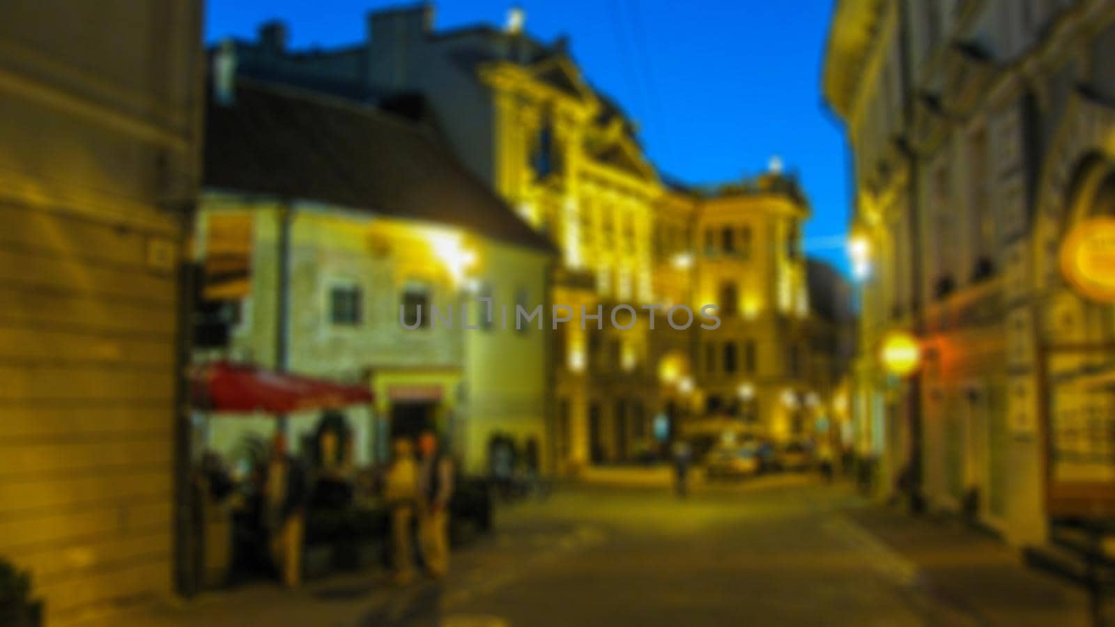 Urban evening landscape. Tourism and travel theme creative abstract blurred background with bokeh effect by Grommik