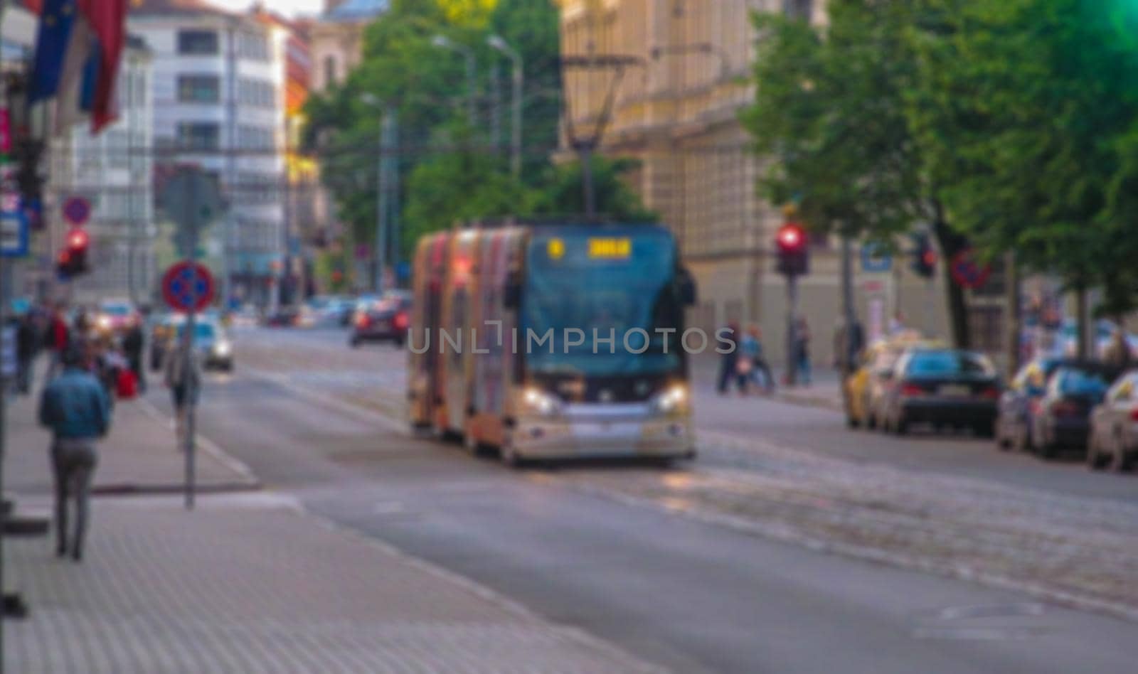 Blurred background of a city street. Urban landscape. Creative theme with blur and bokeh effect for backgrounds, posters and screensavers.
