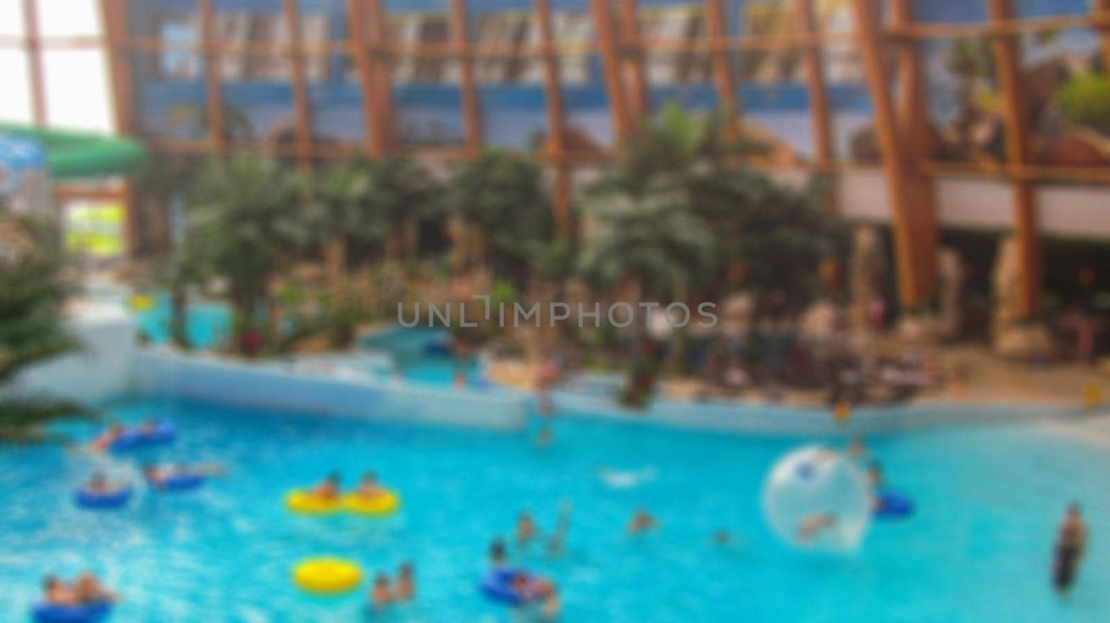 Blur with bokeh elements in a creative story on the theme of recreation in a water Park. Photo for backgrounds and decorations. by Grommik