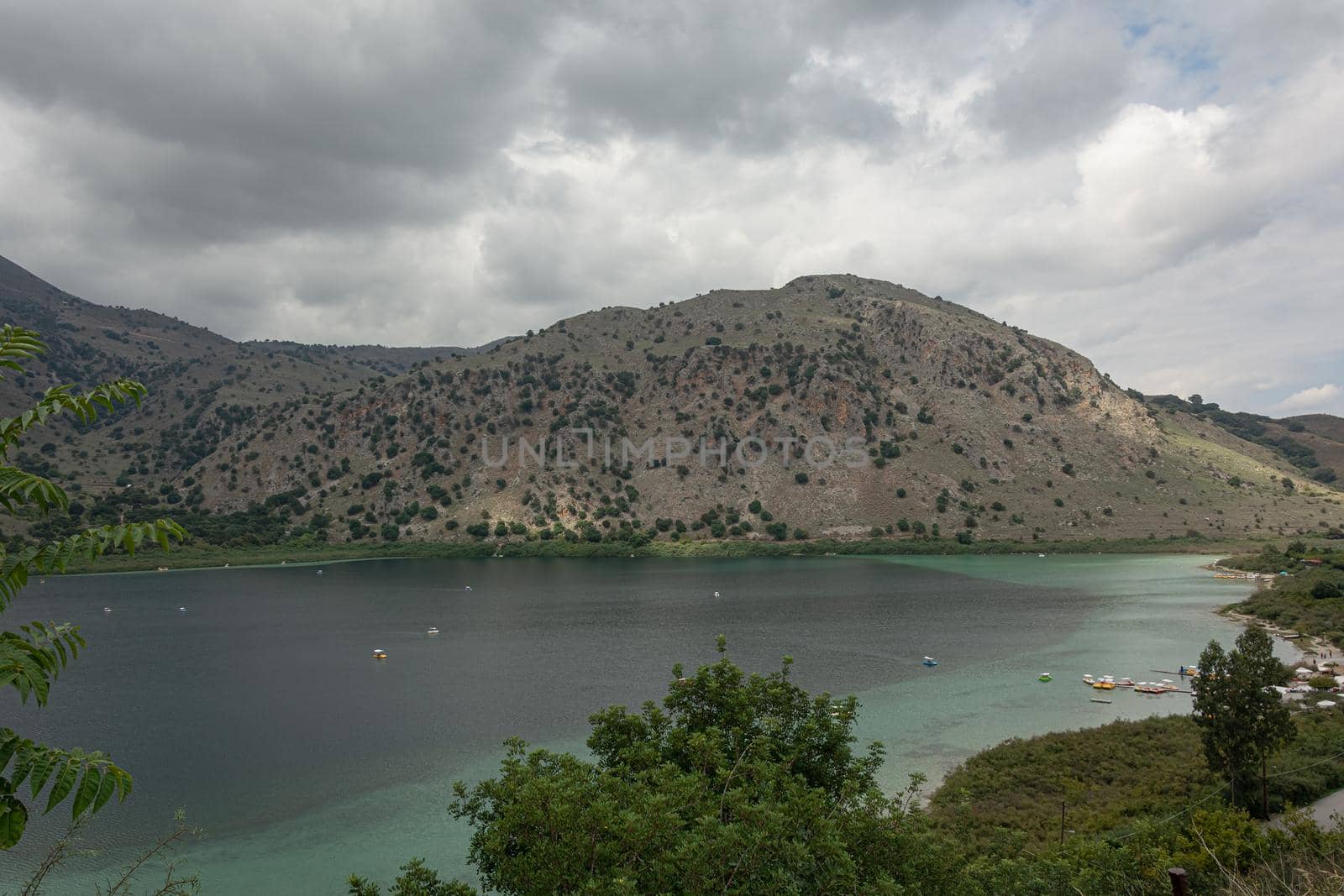 Lake Kournas in a mountainous area. Cloudy weather (Greece, Crete). Stock photo